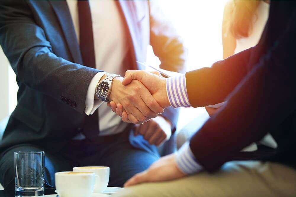 Attorney handshake with clients